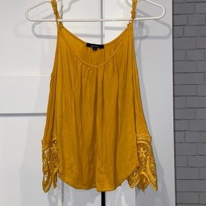 Yellow shoulder cut out top